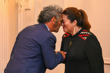 Dame Cindy congratulating Dr Reuben Collier