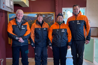 Dr Davies, Francesca Eathorne, Dame Cindy, and Professor Jordy Hendrikx inside a conserved hut.