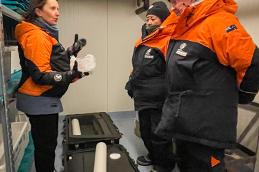 Dr Inga Smith, of Otago University, explaining her work to Dame Cindy and Dr Davies with ice core on display.