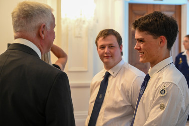 Dr Davies speaking with members of the Boys' Brigade