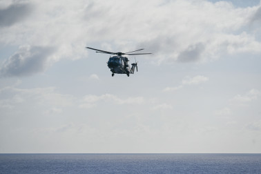 An NH90 returning to ship