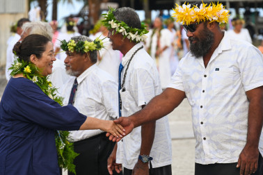 Dame Cindy greeted by a member of the Taupulega