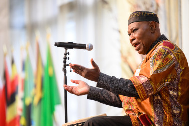 Sam Manzanza performs at the celebration
