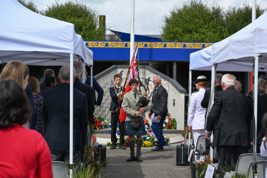 An Ōtaki College piper leads the official party