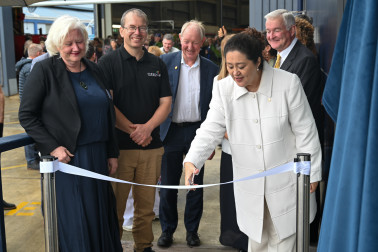Dame Cindy cuts the ribbon to open The Blue House
