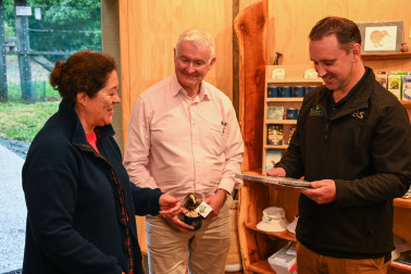 Dame Cindy and Dr Davies presenting Chris McCormack, Chief Executive of the Brook Waimārama Sanctuary, with a gift