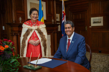 President Whipps signs the Government House visitor book