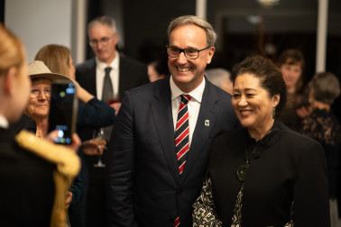 Dame Cindy with a guest at the reception