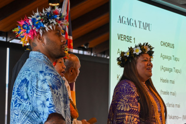 Attendees sing a hymn
