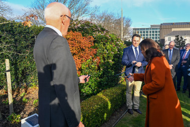 Dame Cindy cuts the ribbon to formally acknowledge the tree planted to commemorate the coronation of King Charles III and Queen Camilla