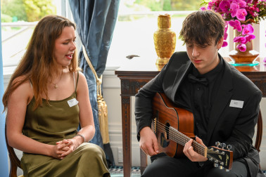 Hannah and Max perform for guests