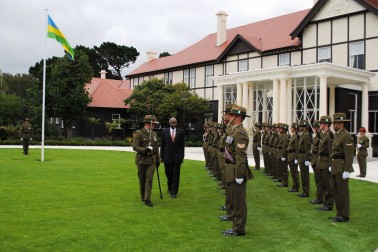 High Commissioner of Rwanda, HE Dr Charles Murigande, inspects the Guard of Honour.