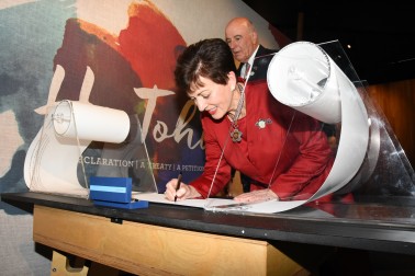 The Governor-General, The Rt Hon Dame Patsy Reddy signing a memorial scroll.