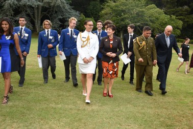 Their Excellencies and students on the lawn at Government House Auckland.