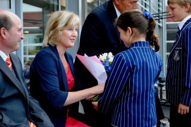 Lady Janine Mateparae is presented with a floral bouquet.