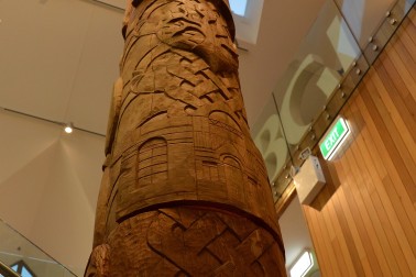 A pou carved for the BGI, depicting its history.