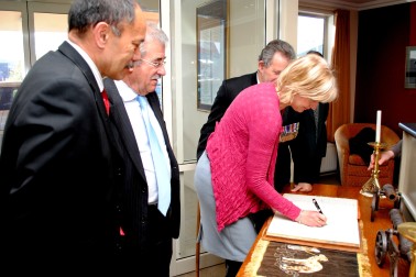 Signing the Visitor's Book.