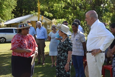Josie Tamate explaining the scope of the farm's produce to Their Excellencies.