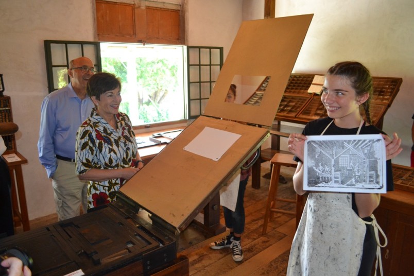 an image of Dame Patsy witnessed and a Russell School student with an image she printed on this heritage machinery