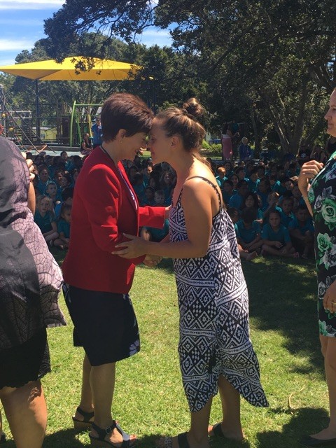 an image of Dame Patsy greeting a teacher at Kaitaia Primary School