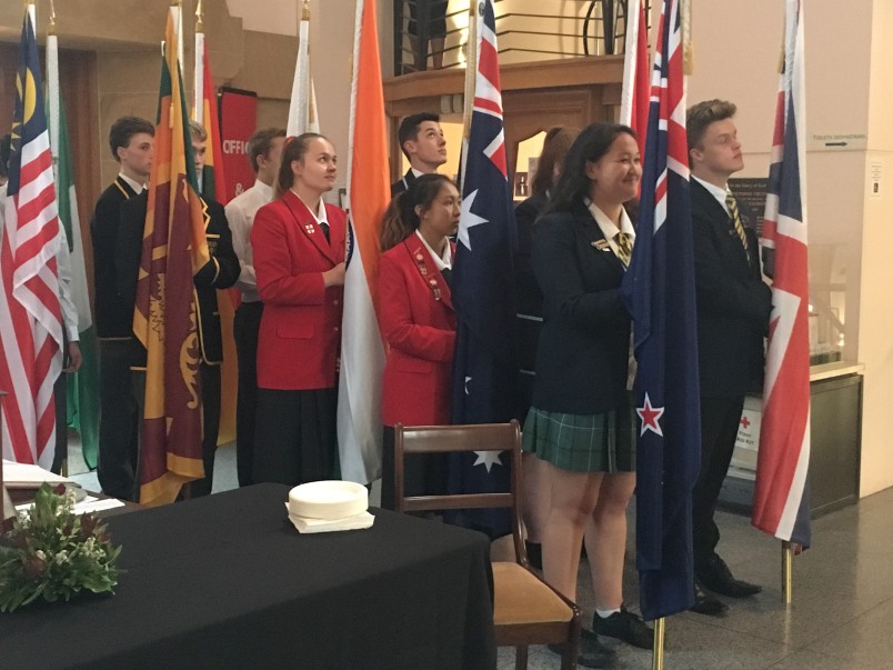 an image of Students carrying flags of the Commonwealth 