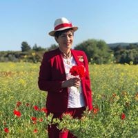 an image of Dame Patsy and poppies at Gallipoli