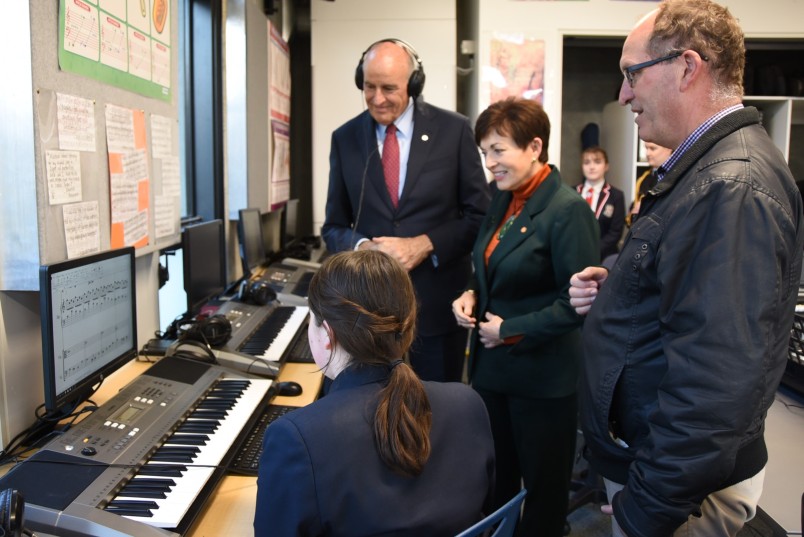 an image of Dame Patsy and Sir David hearing a student's composition in the music lab
