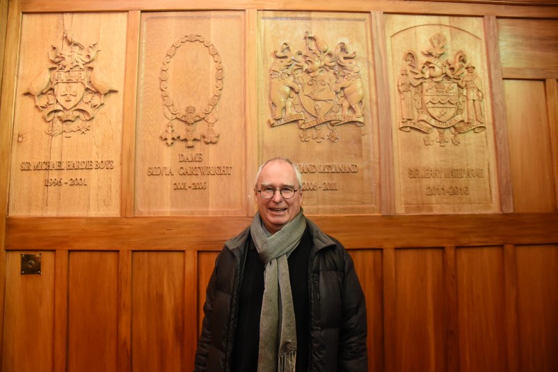 Image of Paul Deans with his carvings
