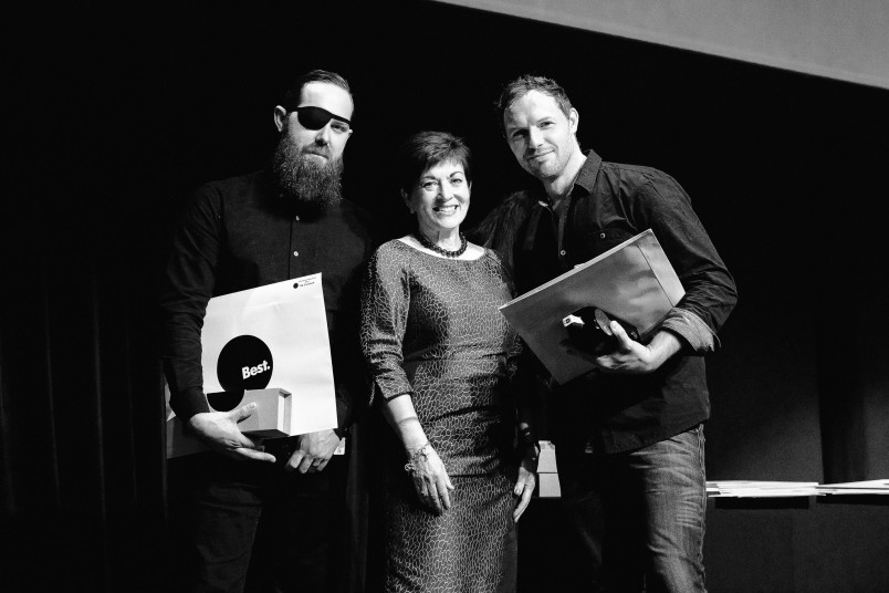 an image of Dame Patsy with Rik Campbell and Steve Le Marquand, winners of John Britten Black Pin Awards