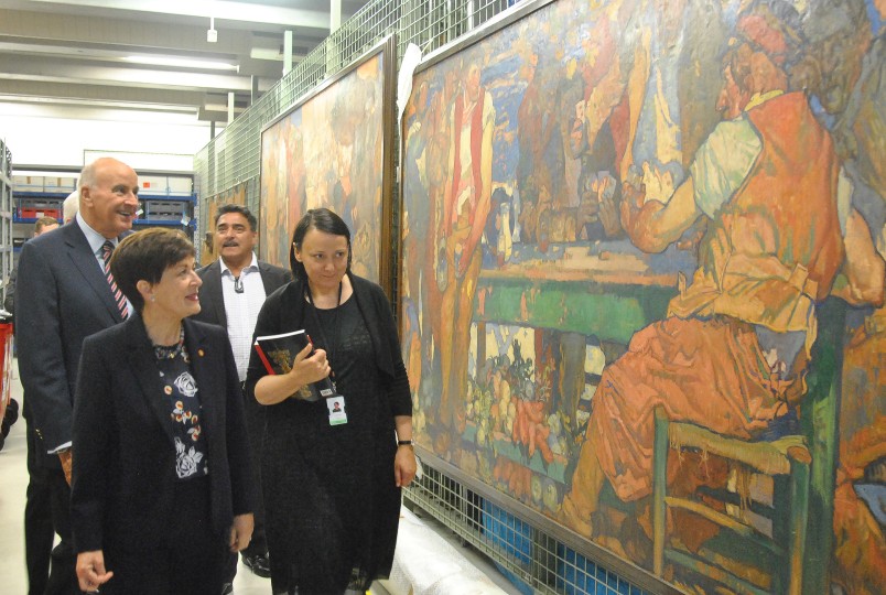 Image of Te Papa Head of Art, Charlotte Davy escorting Dame Patsy and Sir David into the stacks