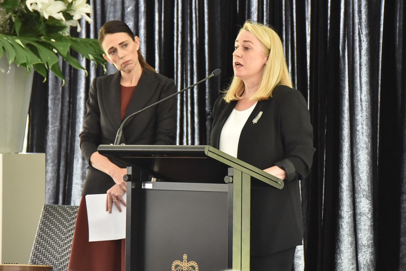 Image of The Prime Minister looking on as Dame Therese Walsh apologises on behalf of Air New Zealand