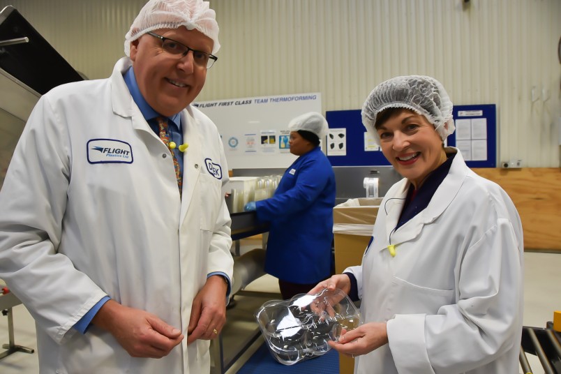 Flight Plastics Director, Derek Lander showing Dame Patsy a tray made of recycled plastic