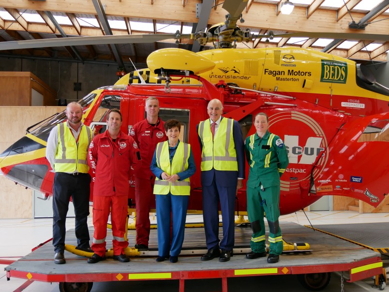 Dame Patsy Reddy and Sir David Gascoigne with the Life Flight Helicopter crew