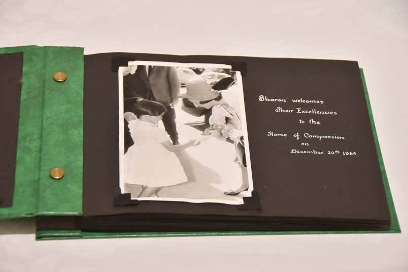 Image of a photo album from a previous Governor-General visit - Lady Fergusson receives flowers