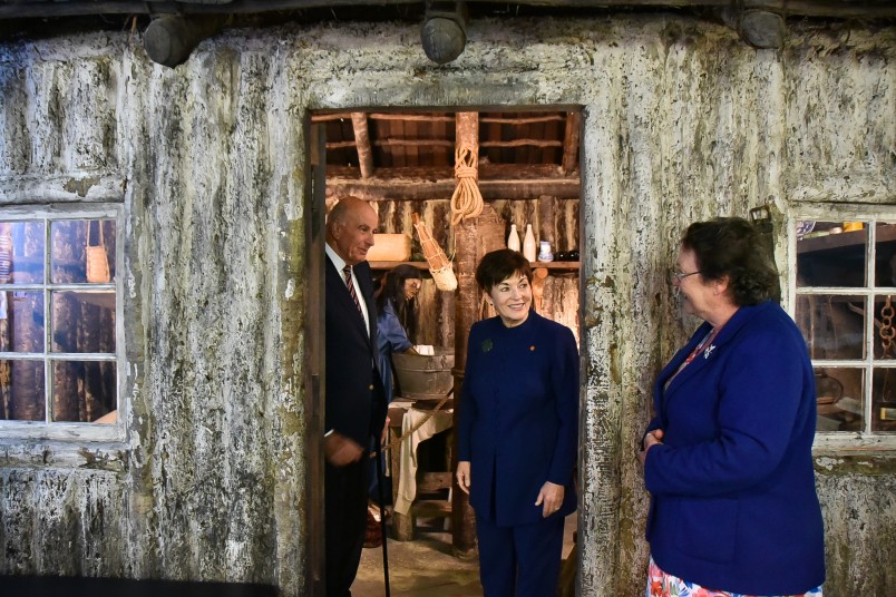 Their Excellencies with a replica settler house, built without nails