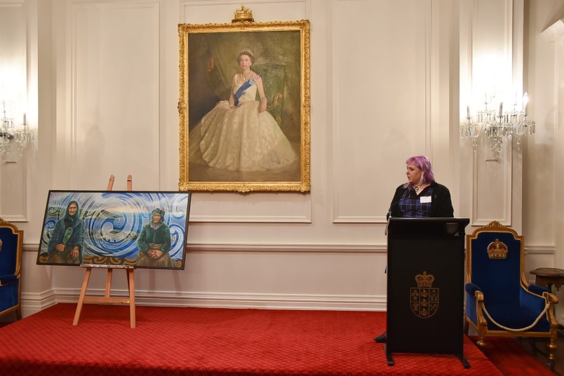 Image of Artist Izzy Joy talking about the symbolism of her painting