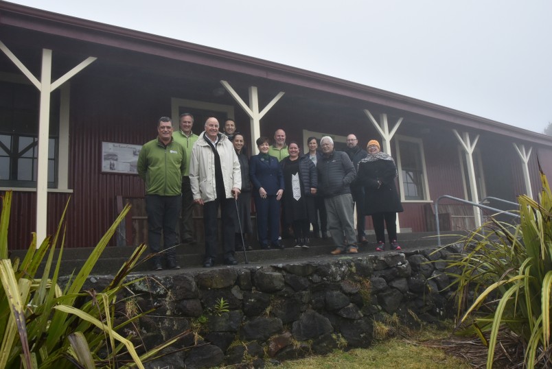 A group photo in front of the Camp House