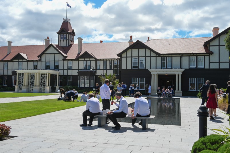 Guests having a picnic on the lawn at Government House