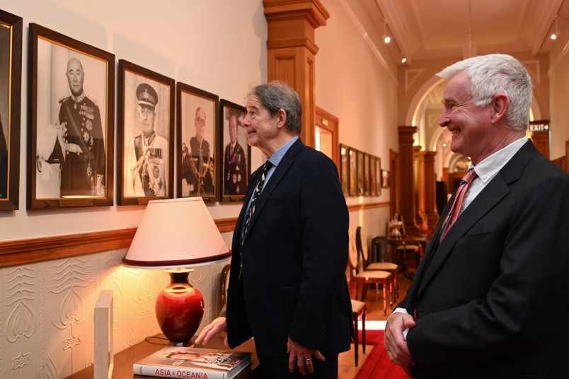 Sir Jonathon Porritt and Dr Davies looking at a portrait of Sir Arthur Porritt