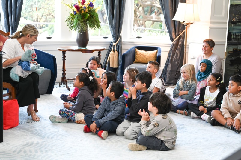 Avril McDonald introducing a character from her book to Newtown School children