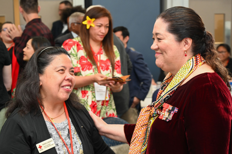 Dame Cindy meeting one of the attendees