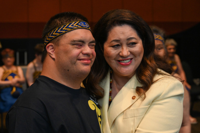 Dame Cindy posing for a photo with one of the performers