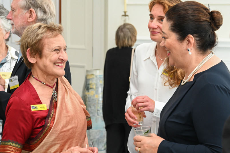 Dame Cindy in conversation with an attendee