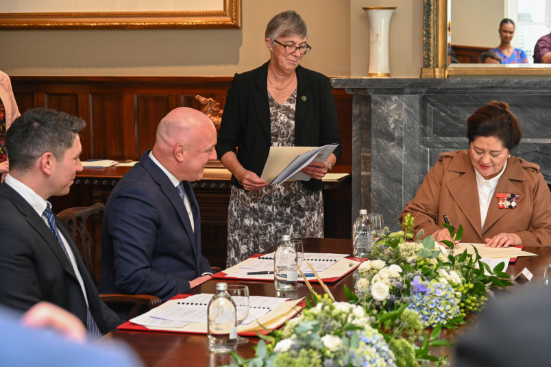 Dame Cindy signing the warrant appointing Mr James Meager a member of the Executive Council
