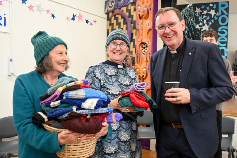 The Reverend Lance Lukin receiving the donated beanies