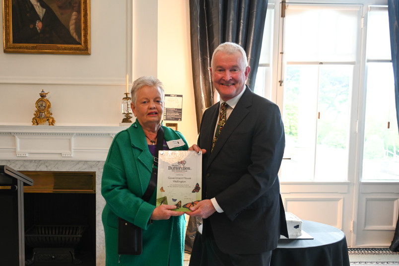 Jacqui Knight presenting a plaque to Dr Davies