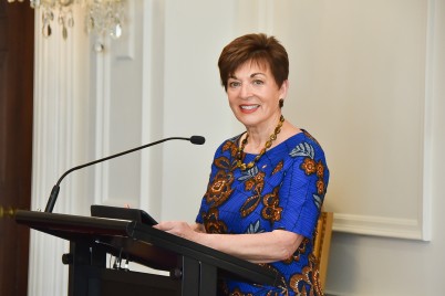 Image of Dame Patsy, about to speak