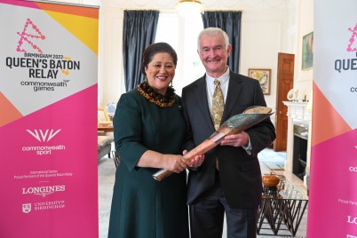 Dame Cindy and Dr Davies with the Queen's Baton