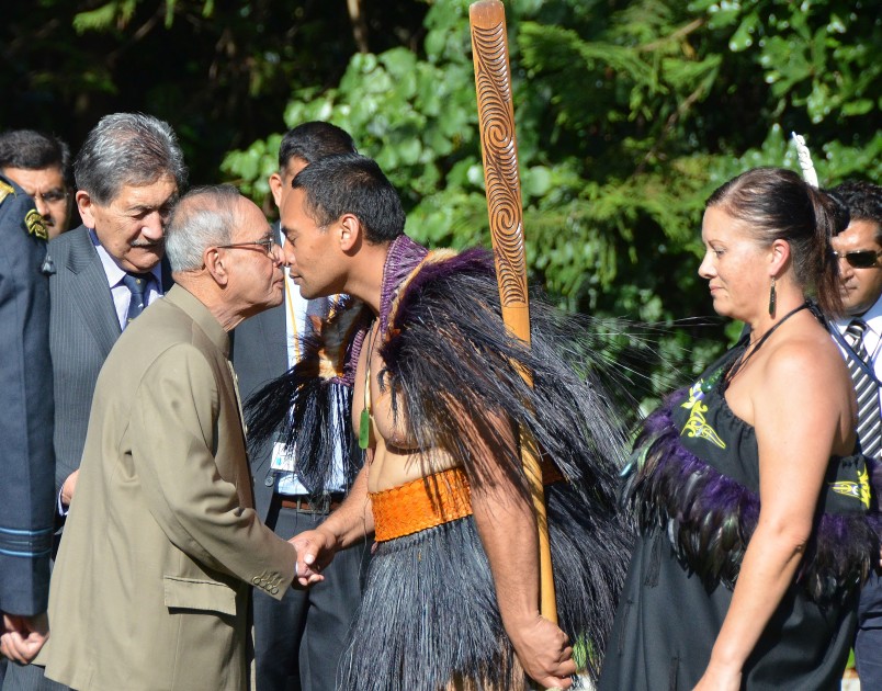 President Mukherjee greets a member of the cultural party.