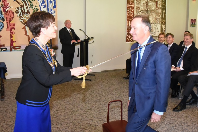 Image of John Key being made a Knight Grand Companion of the New Zealand Order of Merit